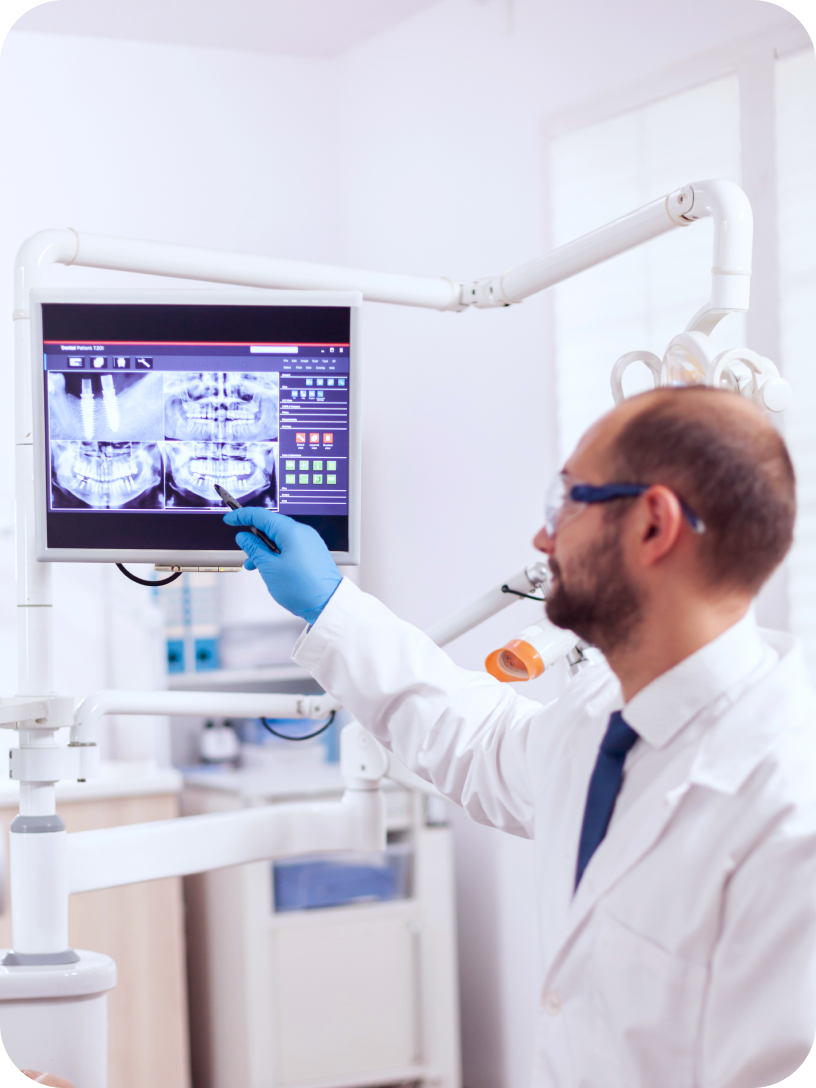 Clinician reviewing dental imaging and documentation on screen